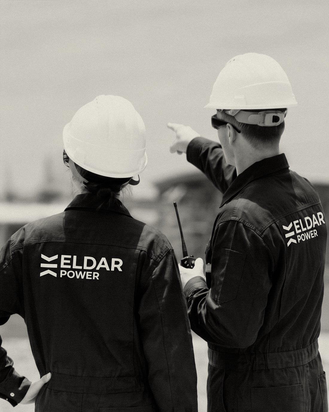 Two Eldar Power engineers on site, one pointing