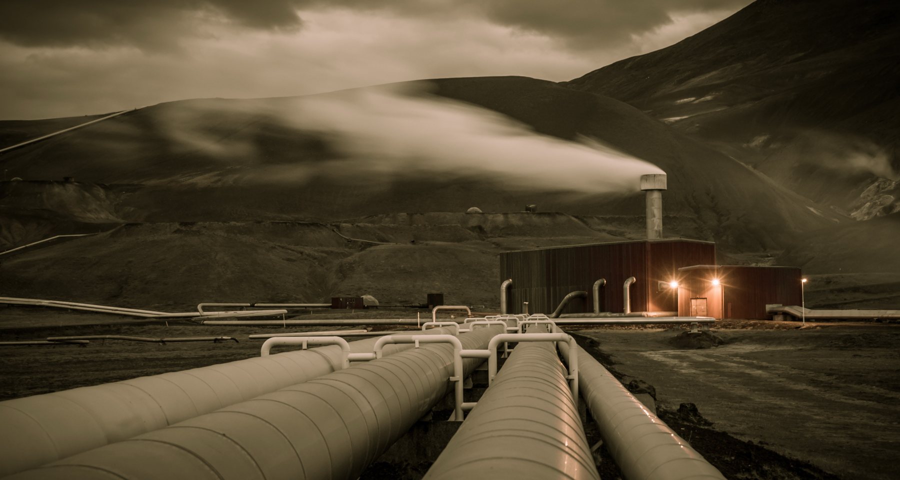 Steam pipelines running to a geothermal power station in Iceland